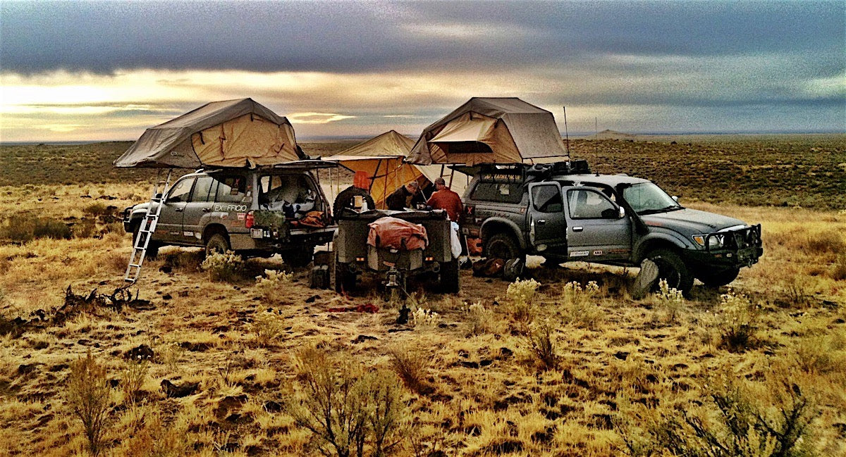 Multiple trucks with mounted roof top tents on adventure