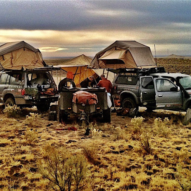 Multiple trucks with mounted roof top tents on adventure