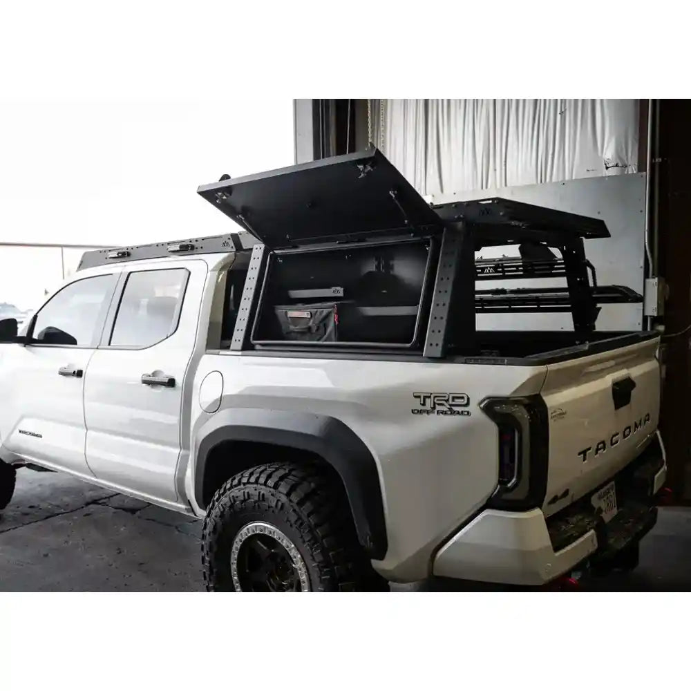 bed rack mounted on white Tacoma