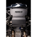 A matte black Juggernaut USA Offroad Outfitters engine cover installed on a vehicle, shown from a top-down view with the engine bay and exhaust components visible.
