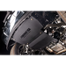 A black Underhill USA 2-Stage Exhaust Diverter installed on a vehicle undercarriage, shown next to the wheel well and exhaust system.
