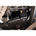 A close-up of a black metal undercarriage shield or splash panel secured with gold-toned bolts on a vehicle's chassis.