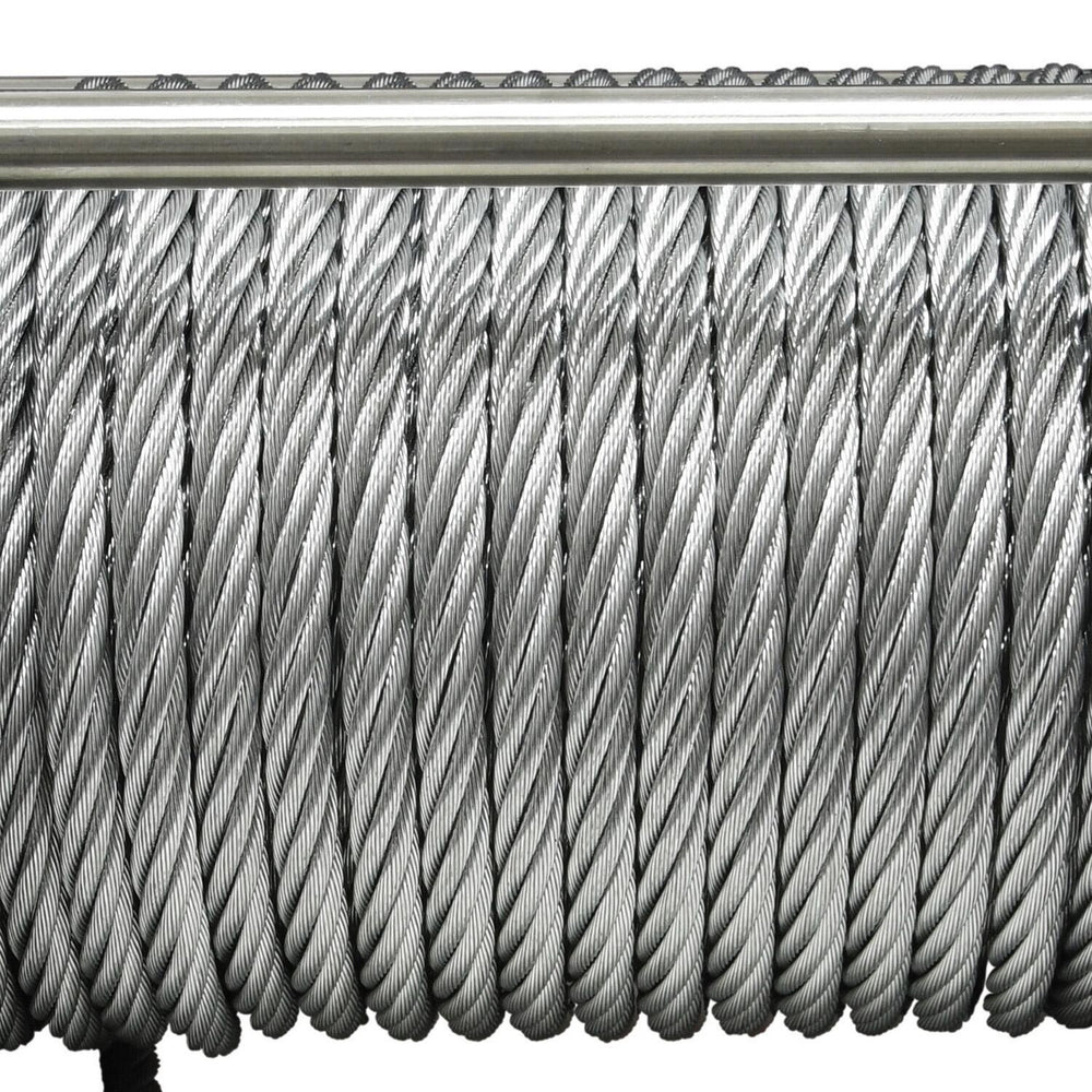 Close-up of a coiled metal cable on a white background
