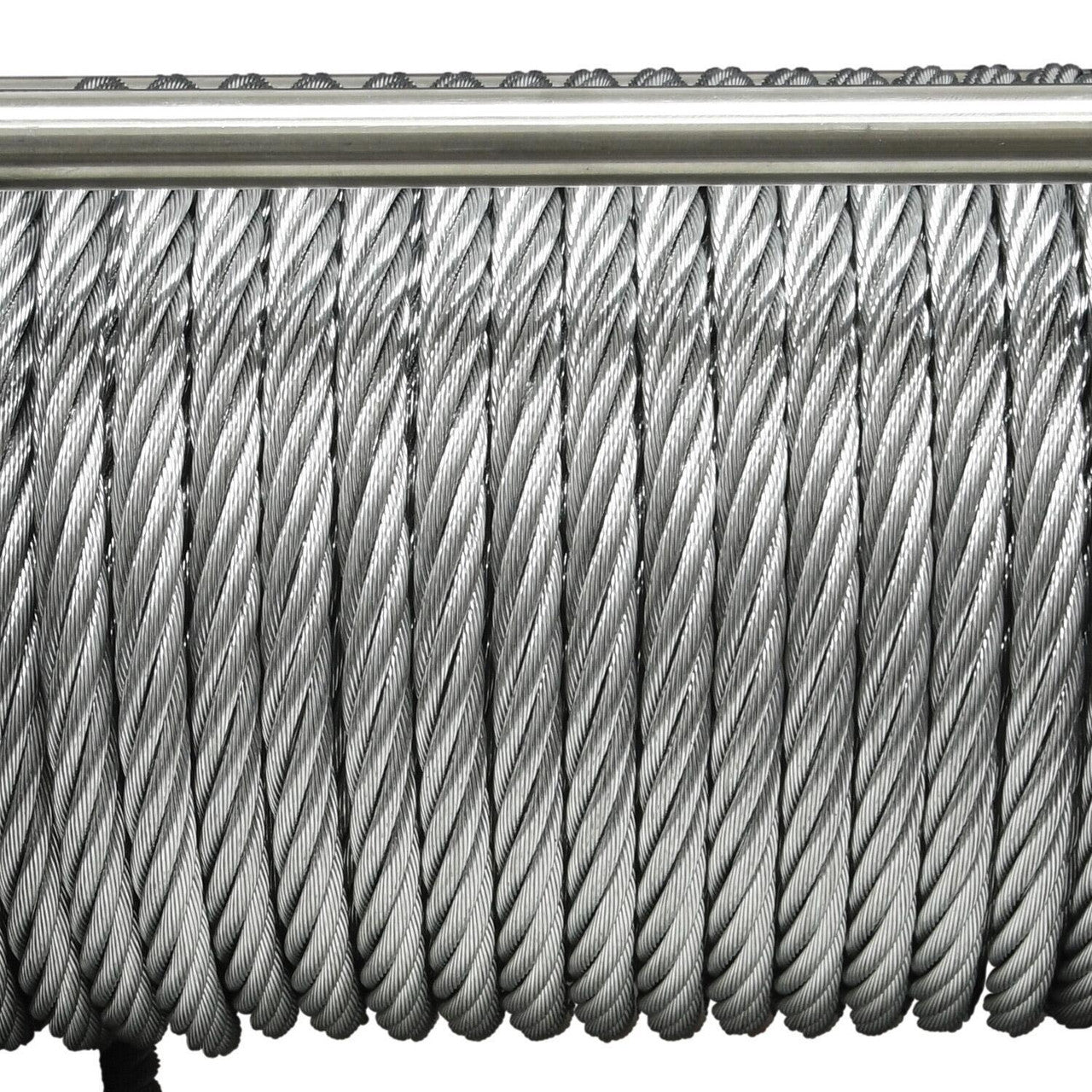 Close-up of a coiled metal cable on a white background