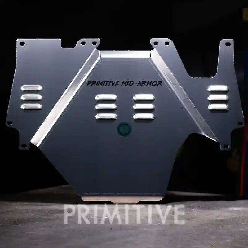 Transmission armor plate with 'Primitive Mid-Armor' branding on a dark background