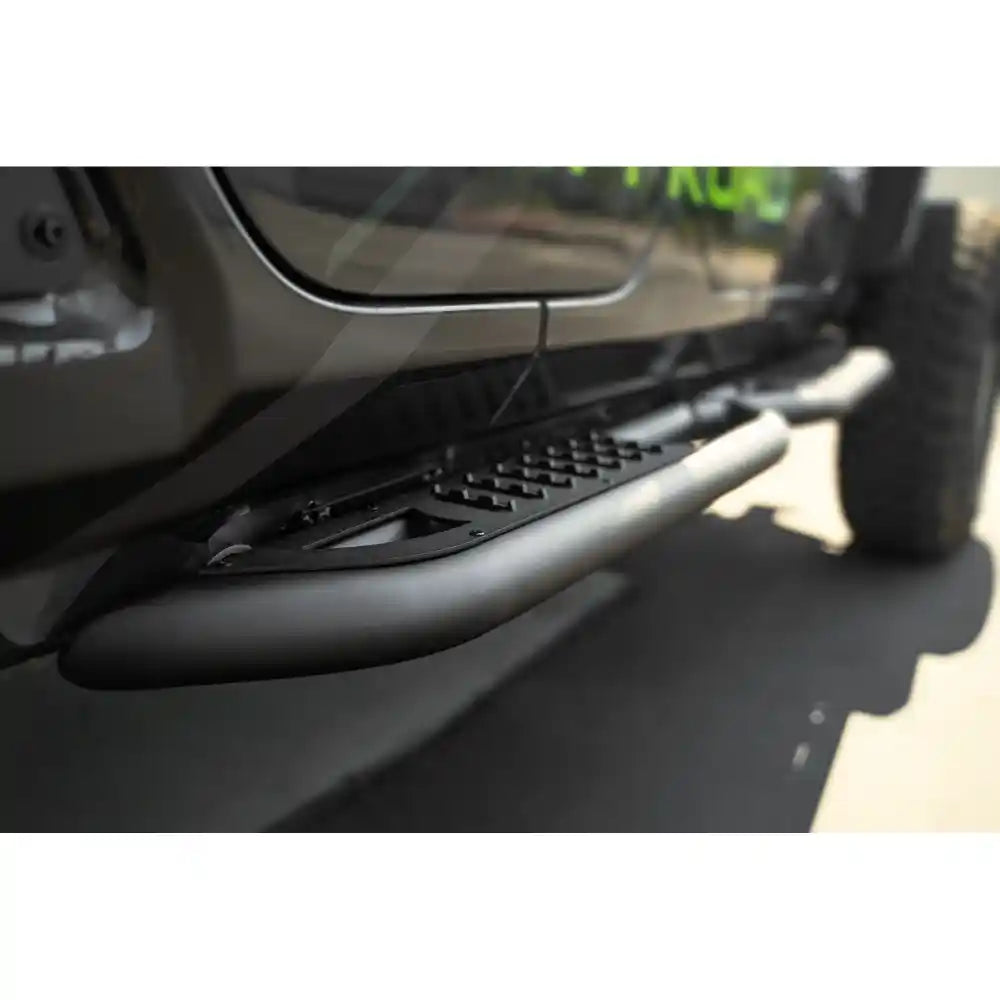 Close-up of a vehicle's side step bar on a truck