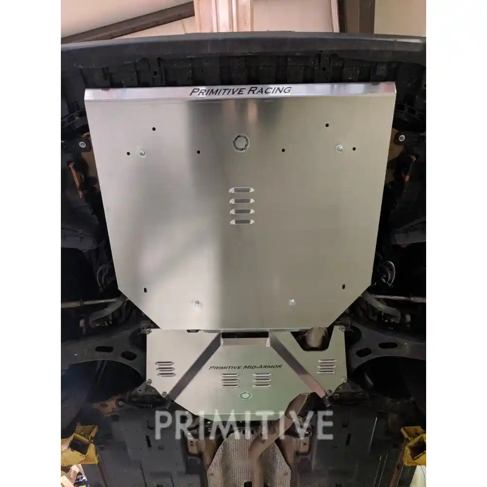 Crosstrek underbody view of the installed front and transmission skid plates.