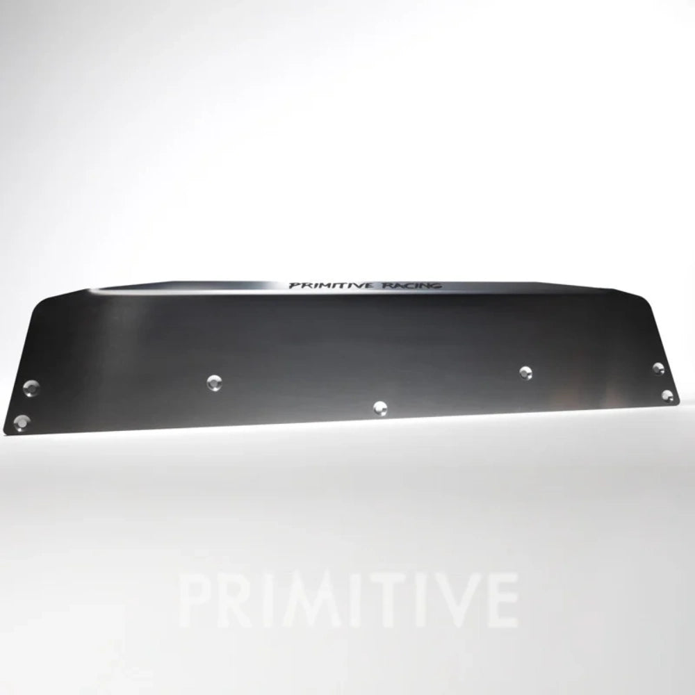 front lip metal plate with 'PRIMITIVE' branding on a white background