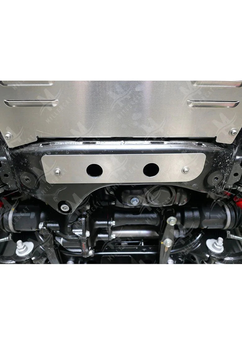 The Millercat catalytic converter shield installed on the undercarriage of a Toyota 4Runner, showing its placement over the exhaust system.