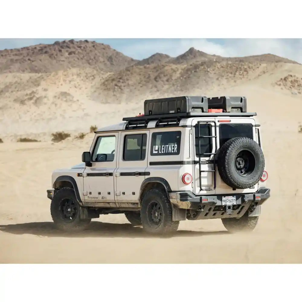 INEOS Grenadier driving off-road featuring Leitner Designs ACS ROOF Platform rack system
