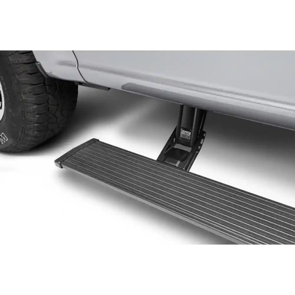AMP PowerStep deployed on silver Chevrolet Silverado 1500
