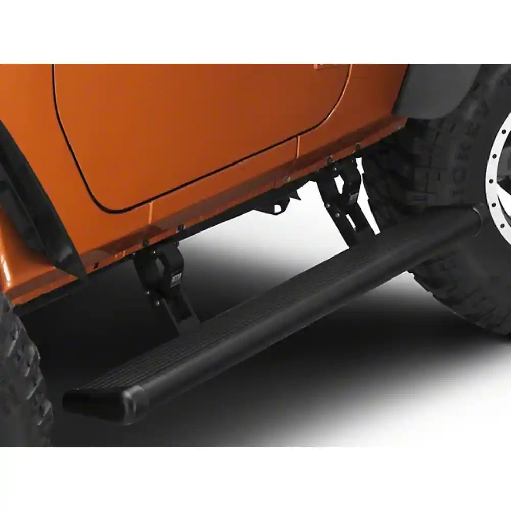 AMP PowerStep extended under orange Jeep Wrangler