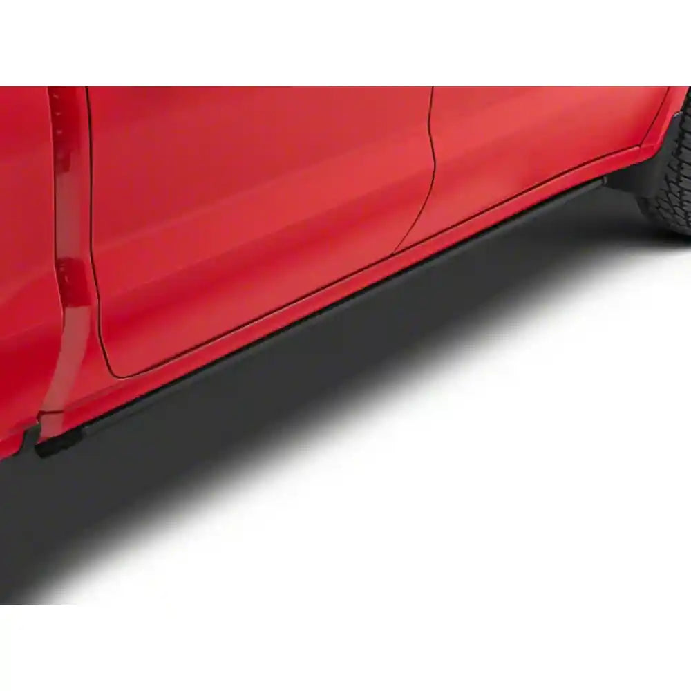AMP Research PowerStep XTreme powered running board deployed on a red Chevrolet Silverado