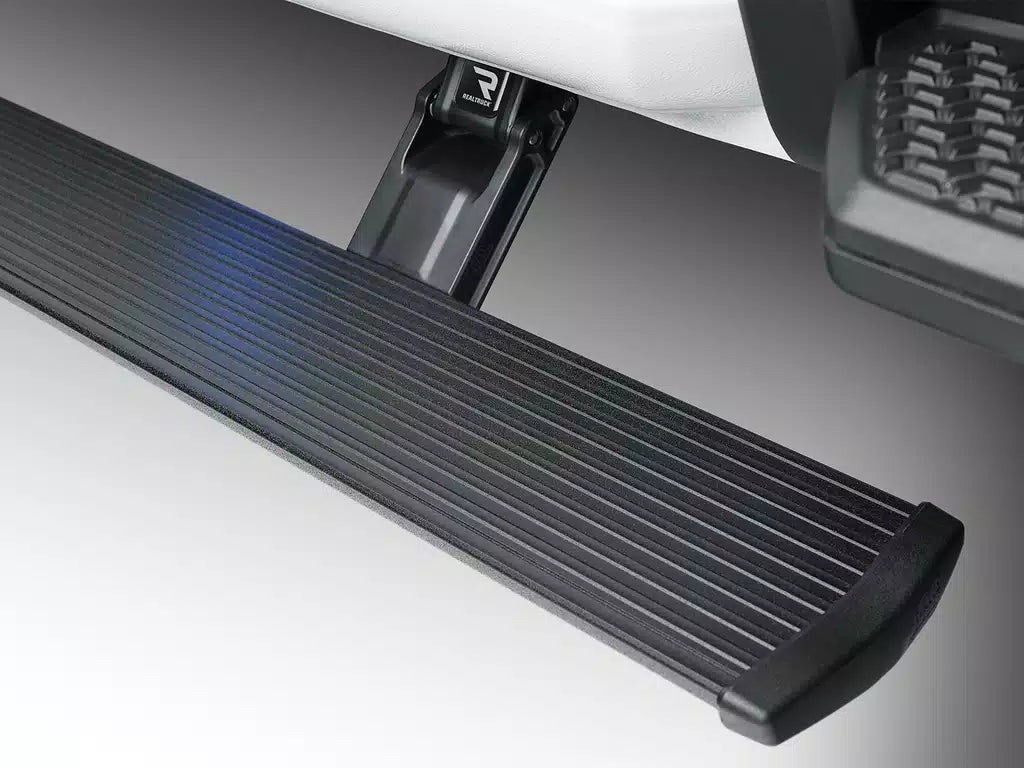 AMP Research PowerStep running board with glowing blue LED light strip.