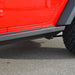 Angled close-up of black triangular step bracket on JK slider