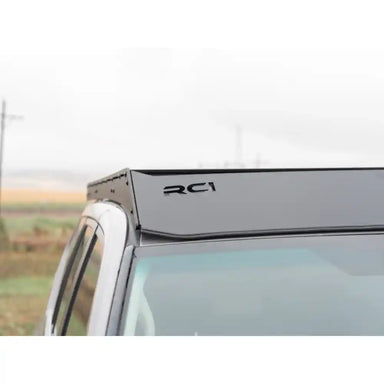 Angled view of RCI full-length rack on silver GX460 showing aerodynamic rear edge and mounting