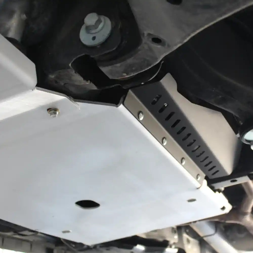 Black RCI catalytic converter guard with vented pattern – installed