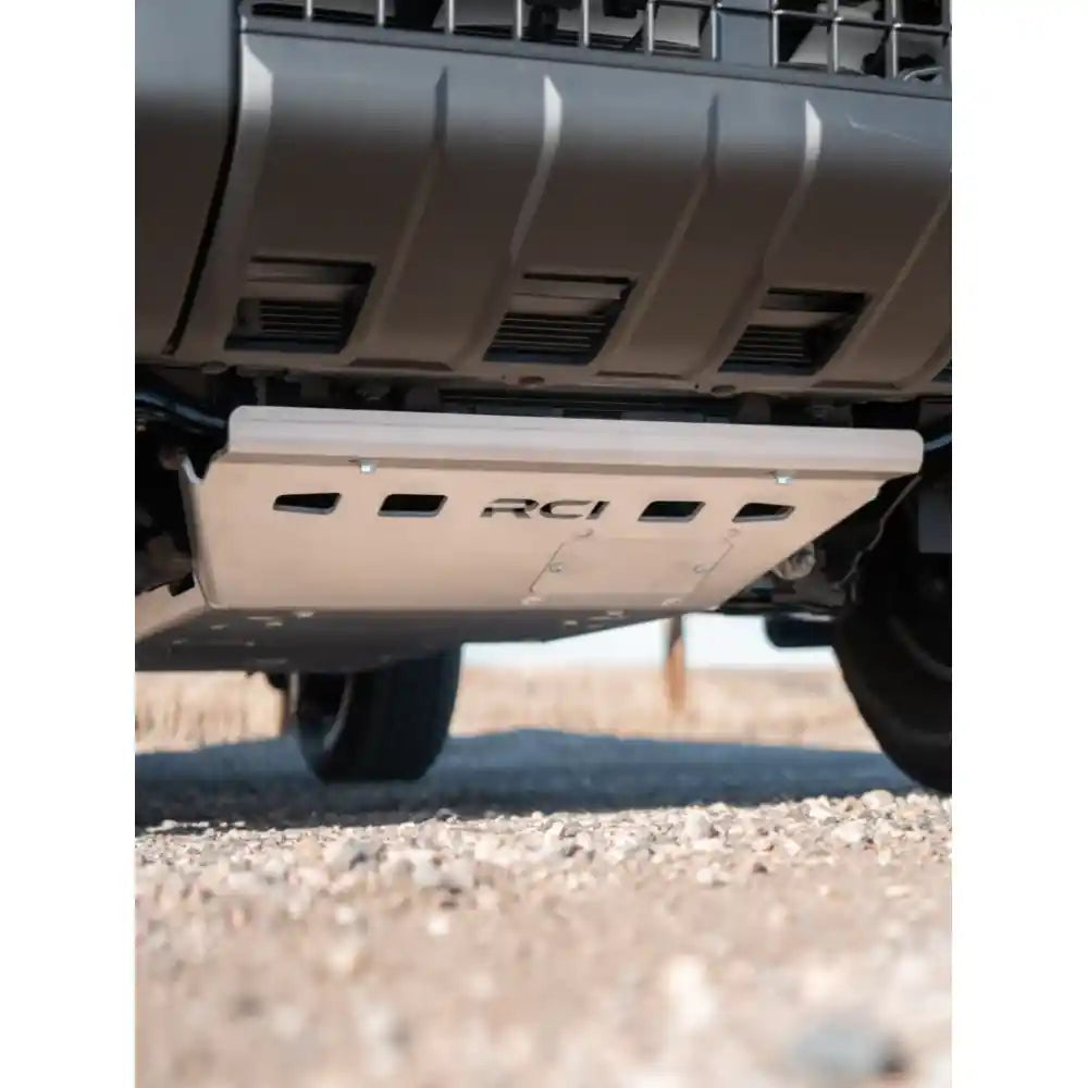 Black RCI engine skid bolted to Toyota undercarriage with straps