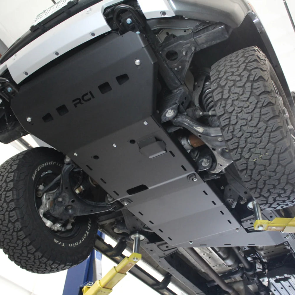 Black RCI transfer case skid with slots, side view.