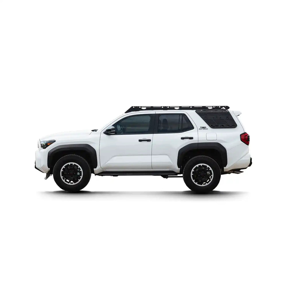 White 4Runner with a Sherpa Capitol roof rack on a white background