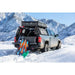 Chevy with mounted ACS bed rack by Leitner and snowboard gear in a snowy mountain landscape