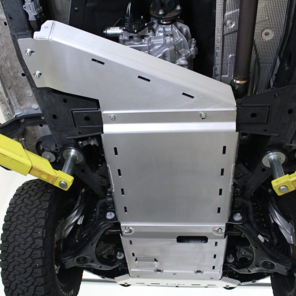 Close-up RCI transmission skid plate under Ranger drivetrain.
