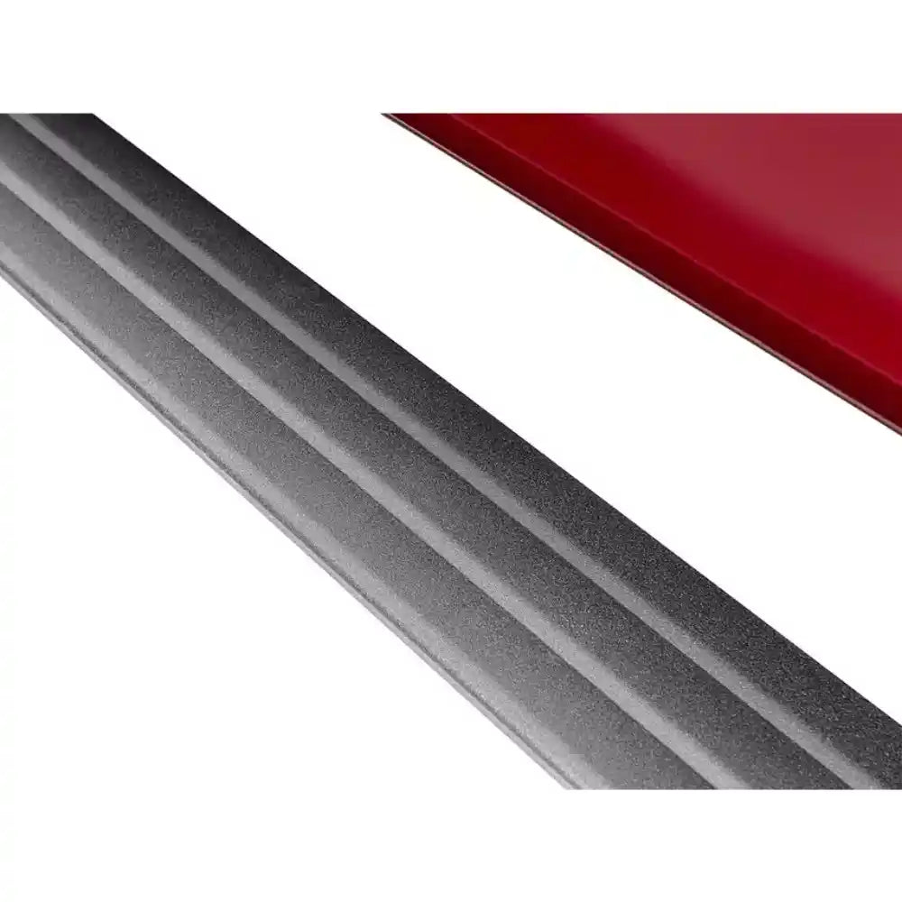 Close-up of AMP PowerStep rail on red truck
