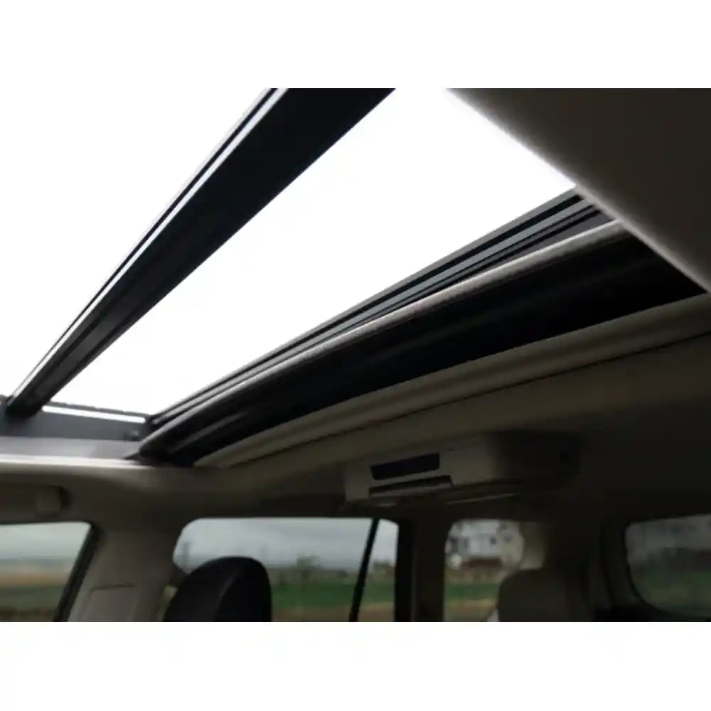 Close-up of RCI roof rack side panel and T-slot channels bolted onto GX460 in open field