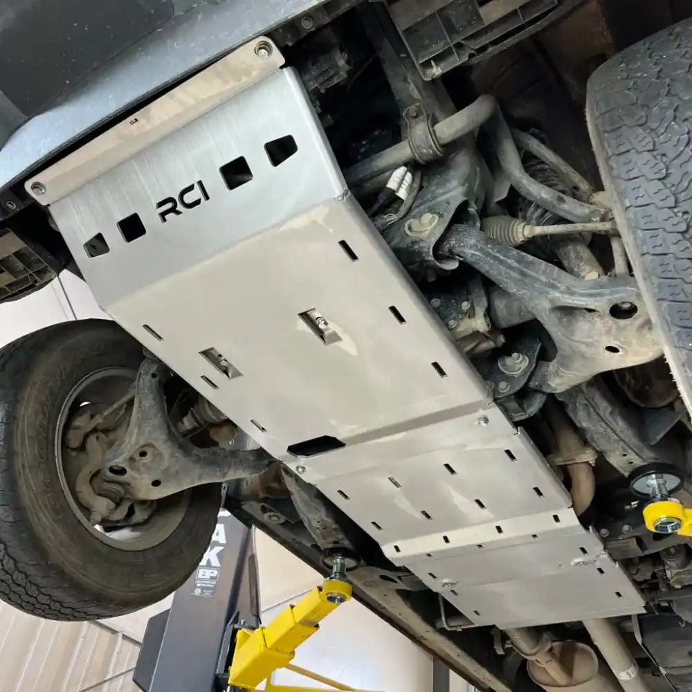 Close-up of RCI transmission and mid-section skid plates on lifted Colorado