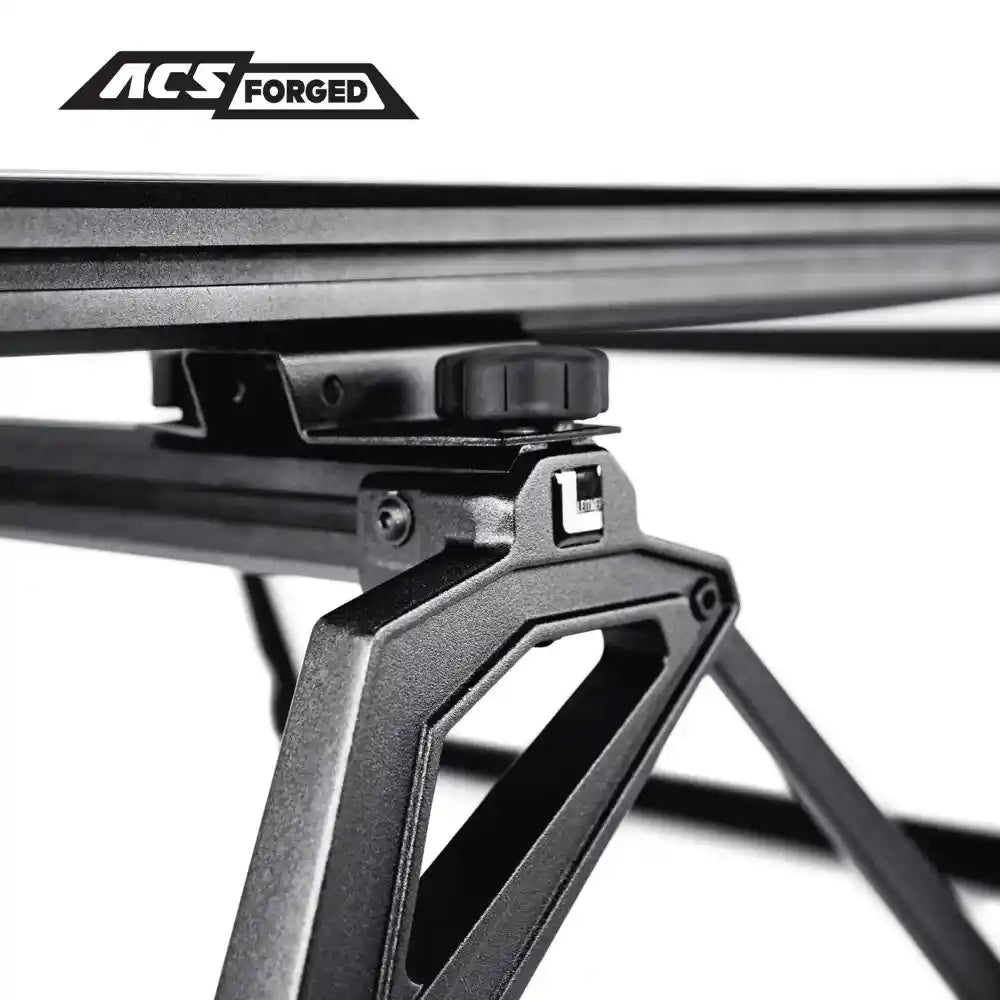 Close-up of a Leitner metal bed rack with 'ACS Forged' branding on a white background