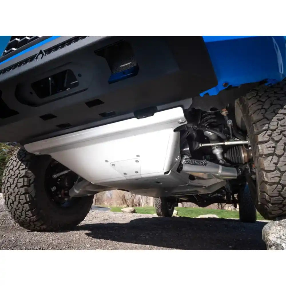 Close-up of a Tacoma's undercarriage showing Artec Industries skid plate