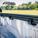 Close-up of a bed rack rail mounts on Nissan with a blurred natural background