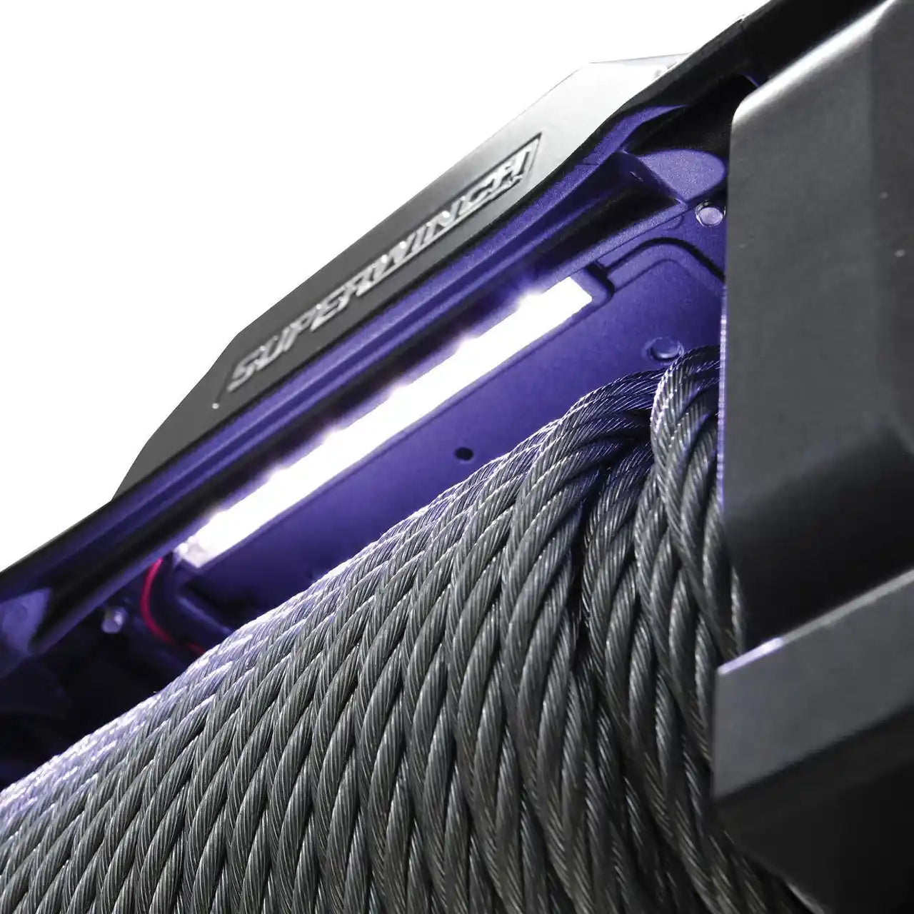 Close-up of a illuminated winch cable with 'Superwinch' branding on a white background