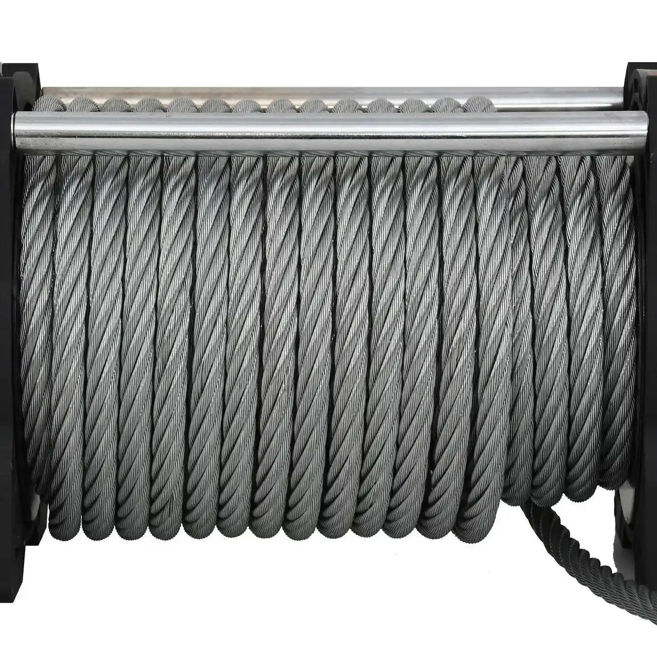 Close-up of a winch with coiled steel cable on a white background