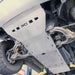 Close-up of black RCI logo branding on front skid plate section