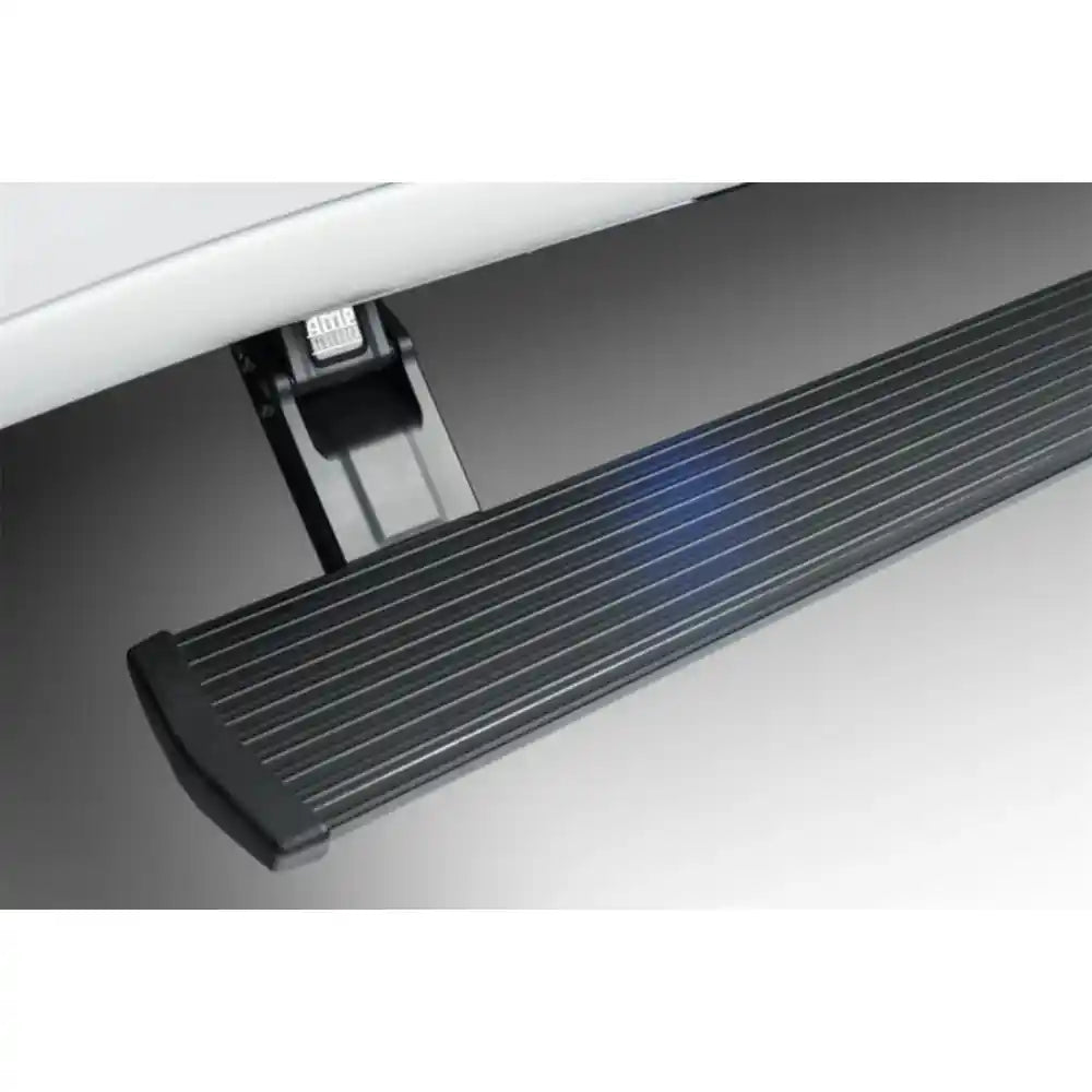 Close-up of black textured AMP PowerStep running board with blue LED lighting
