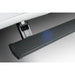 Close-up of black textured AMP PowerStep running board with blue LED lighting