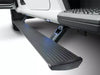 Close-up of black textured AMP Research PowerStep extended from white truck.