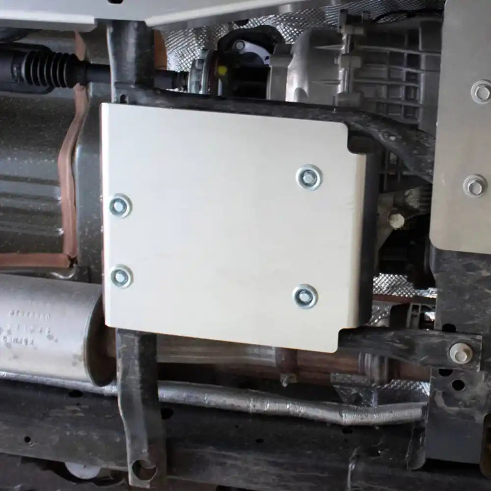 Close-up of engine bay with Asfir front skid plate bolted in place