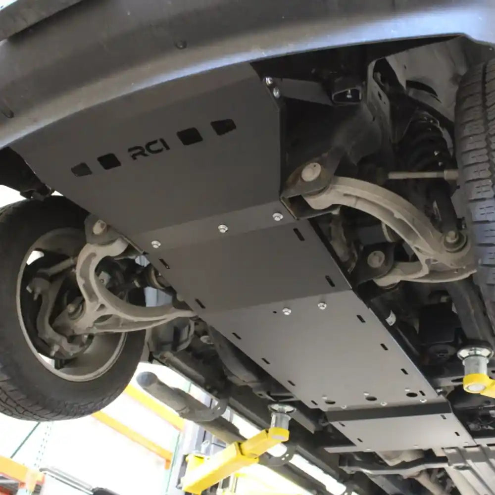 Close-up of front skid plate edges and mounting hardware under 2019+ Ram 1500