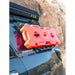 Close-up of red fuel jugs mounted via RCI MOLLE panel on black 4Runner roof rack.