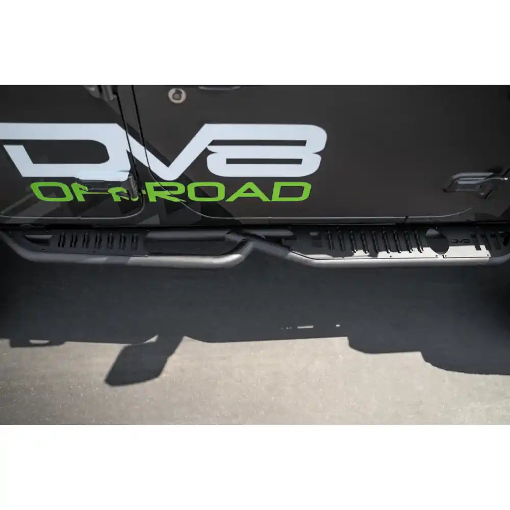 Close-up of step slider on a Jeep Wrangler with 'DV8 Off Road' branding on a black background