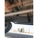 Close-up underside shot showing RCI fuel skid plate protecting tank area with exhaust visible