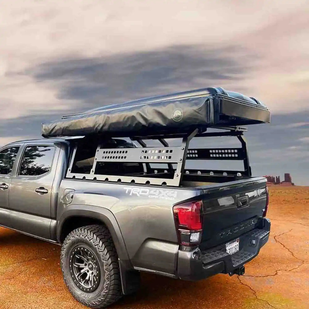 Installed OVS discovery rack with a rooftop storage unit on tacoma in a desert landscape