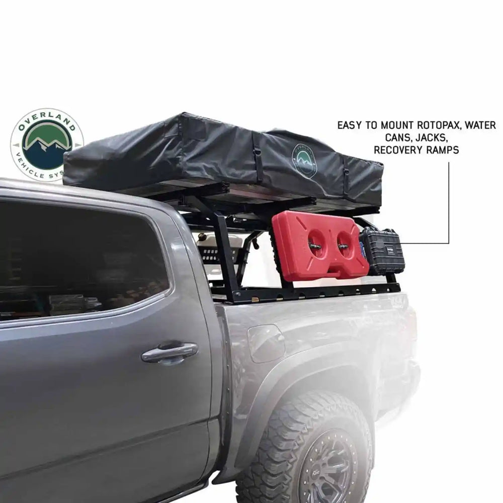 Bed rack system on a truck with Overland Vehicle Systems logo, featuring easy-to-mount components.