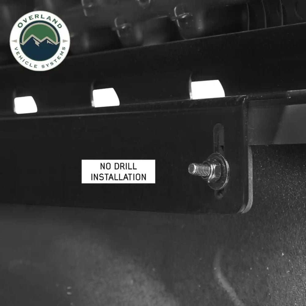 Discovery rack black metal bracket with 'No Drill Installation' label and Overland Vehicle Systems logo.