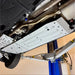 Exhaust and aluminum skid plates from angled view