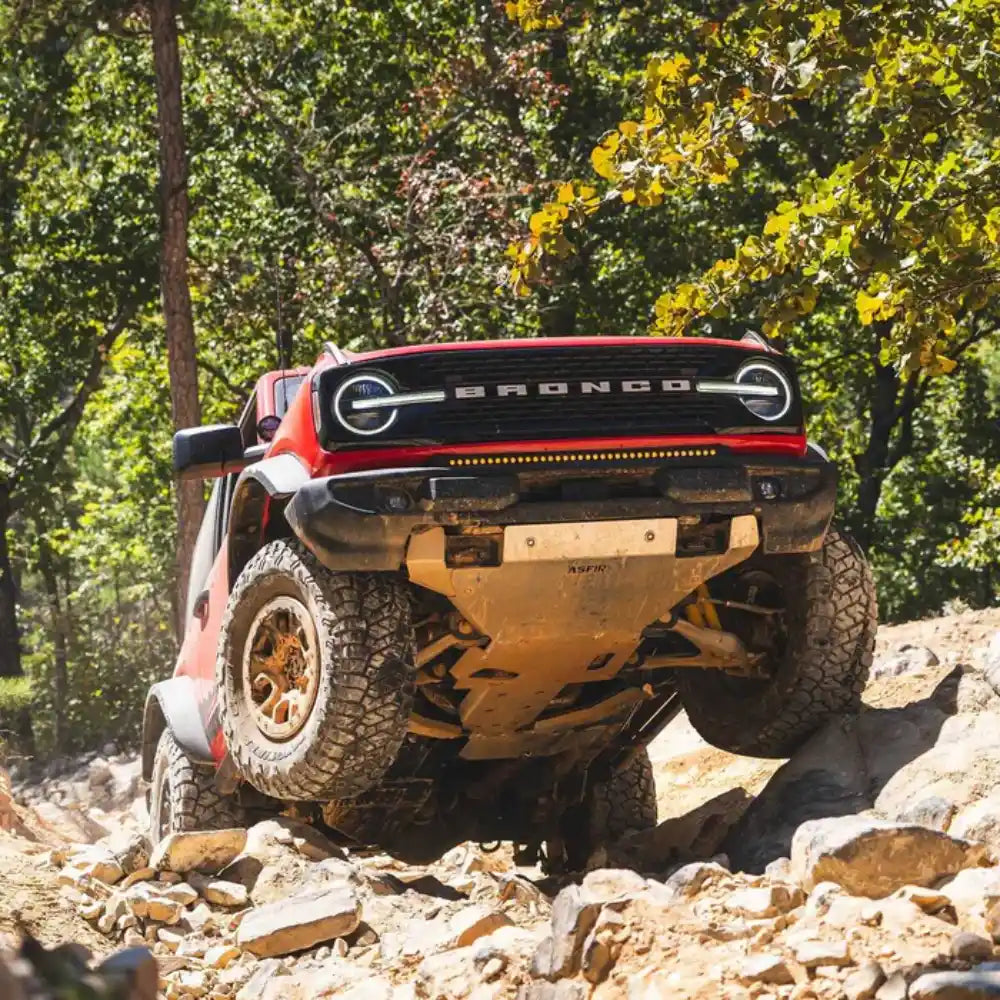 Ford Bronco with Asfir 4x4 front skid plate protecting OE plastic bumper off-road