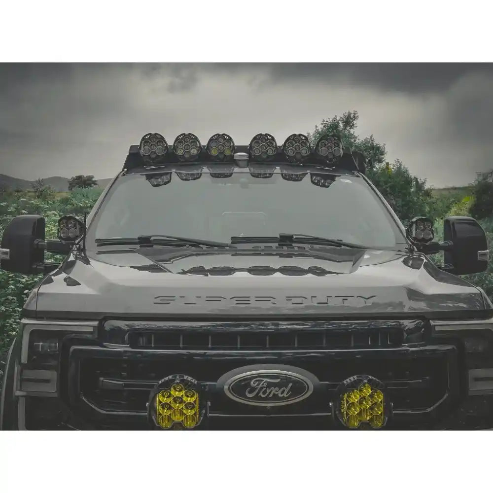Ford Super Duty truck with additional lights on a cloudy day