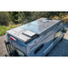 Solar panel on the roof of a blue Transit with a natural background